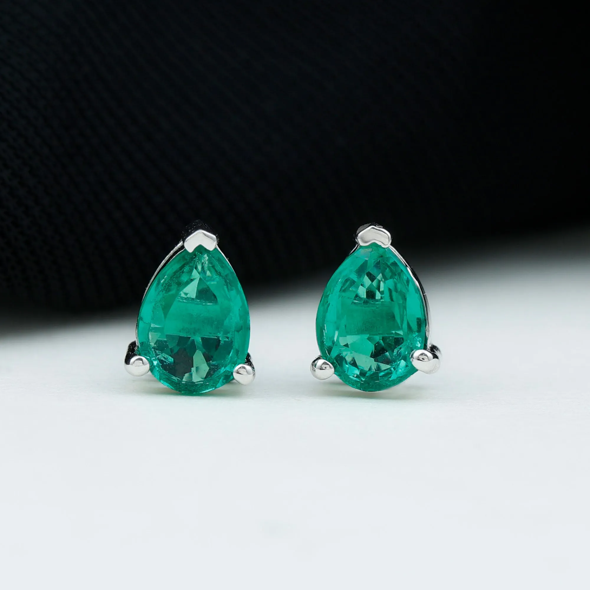 Pear Cut Lab Grown Emerald Solitaire Stud Earrings in 3 Prong Setting